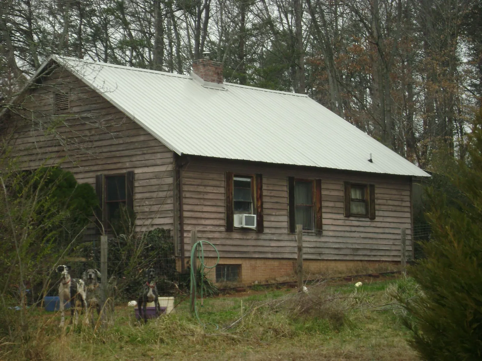 White metal roof on an old wood sided farmhouse, from a Metal Roof Installation job in South Gate